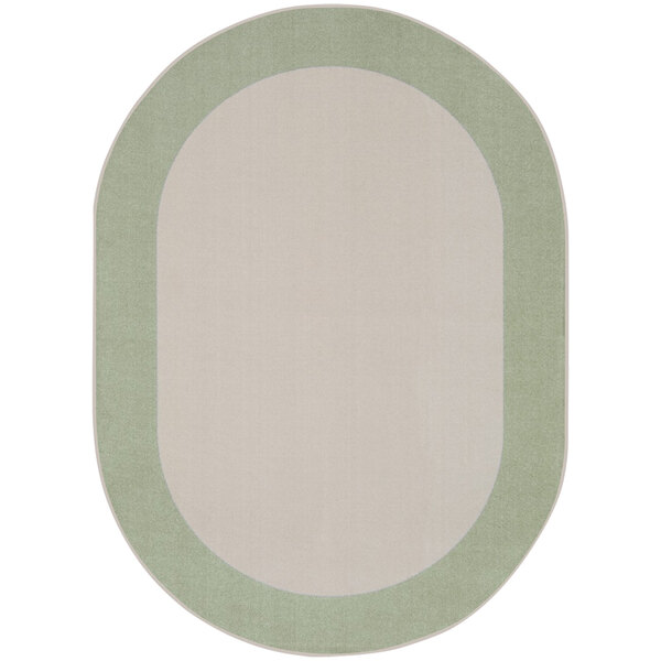An oval area rug with a green border and white background.