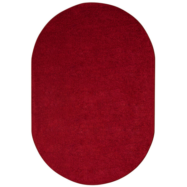 A burgundy oval rug with a white border.
