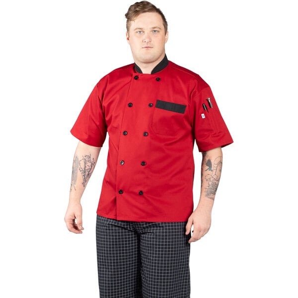 A man wearing a red Uncommon Chef short sleeve chef coat with black trim.