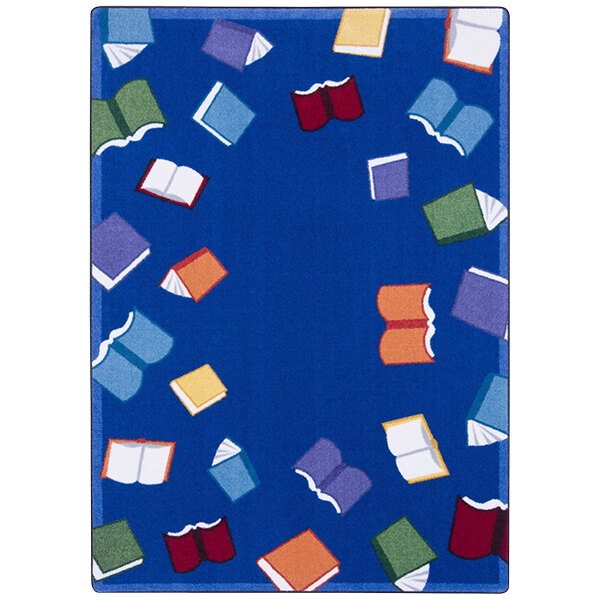 A multi-colored area rug with blue squares and books on it.