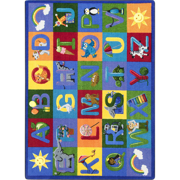 A white rectangular area rug with colorful letters and animals.