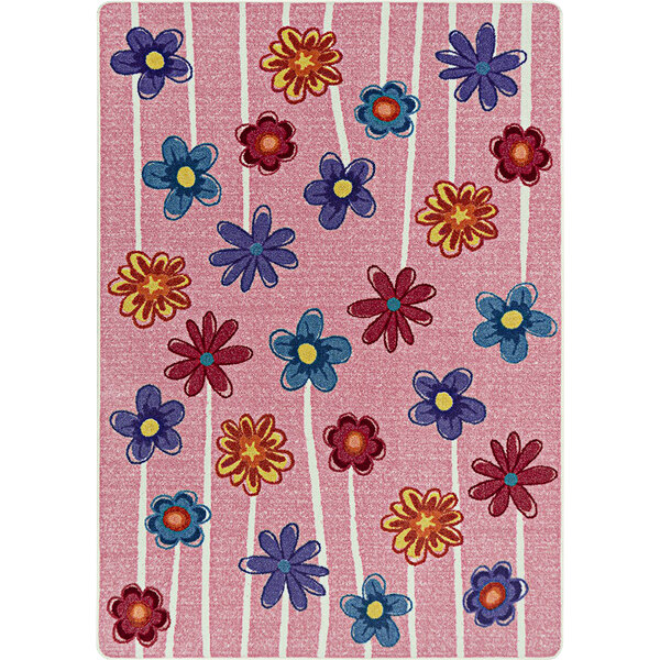 A pink Joy Carpets area rug with colorful flowers on it.