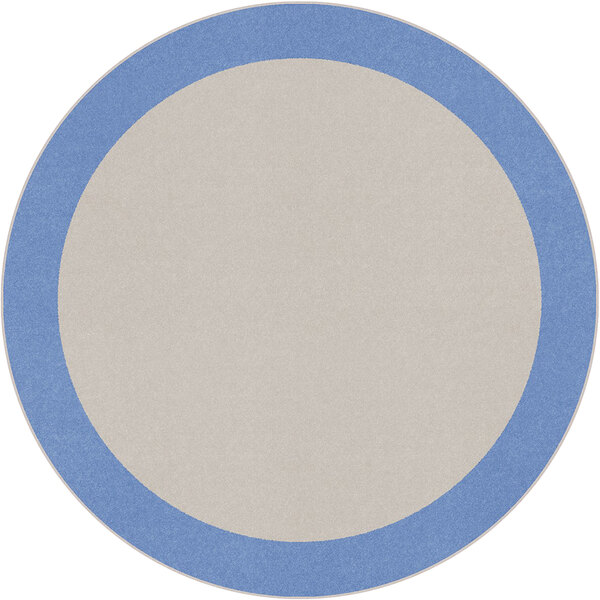 A blue and white round rug with a white border.