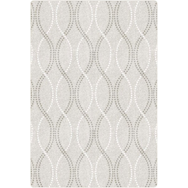A white rectangular area rug with a gray wavy design.