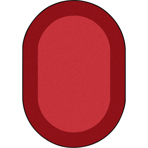 A red oval shaped Joy Carpets area rug.
