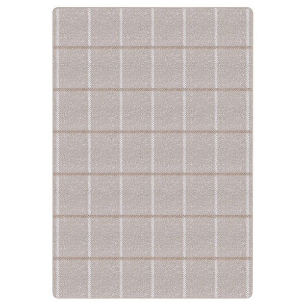 An ivory rectangular area rug with squares on it.