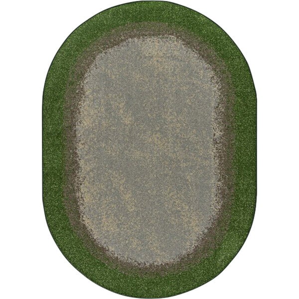 An oval area rug with a green border and grass in the center.