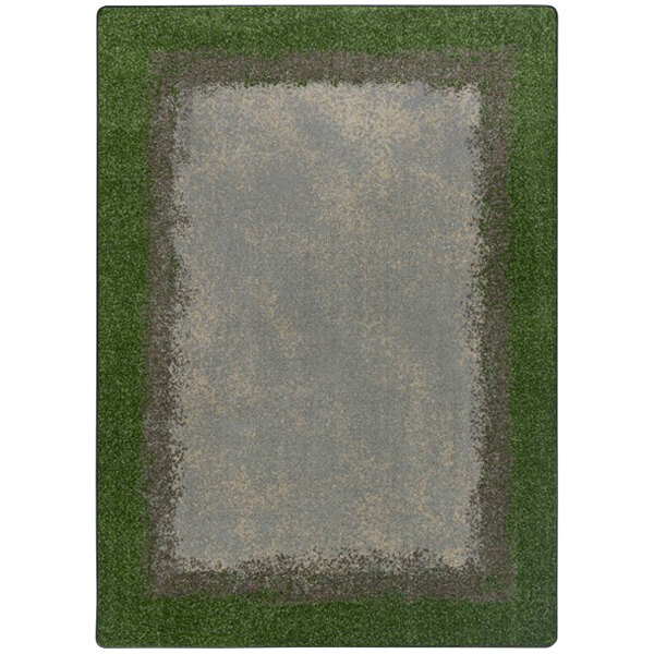 A white rectangular area rug with a green and gray border and black lines on the edges.