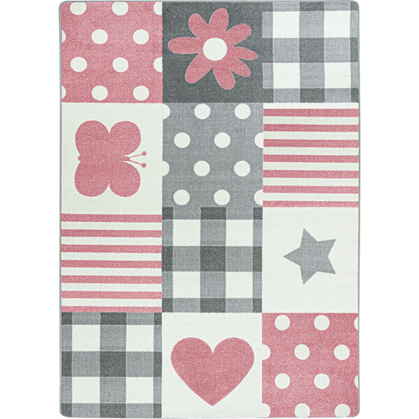 A Joy Carpets Claremont Kids Patchwork Girl area rug with pink and grey hearts and flowers.