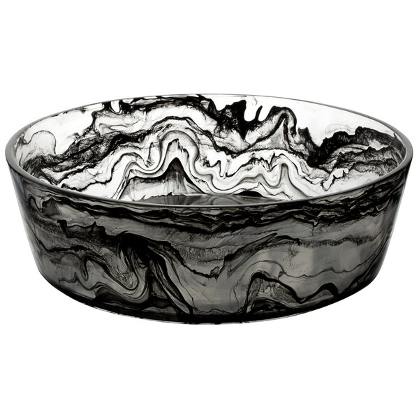 A black and white resin bowl with swirls on a counter.