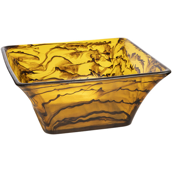 A yellow square Bon Chef resin bowl with black swirls.