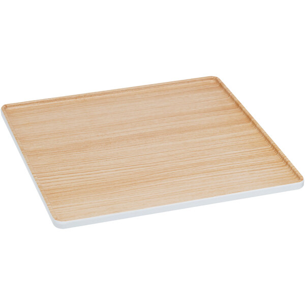 A square wooden tray with a white border.