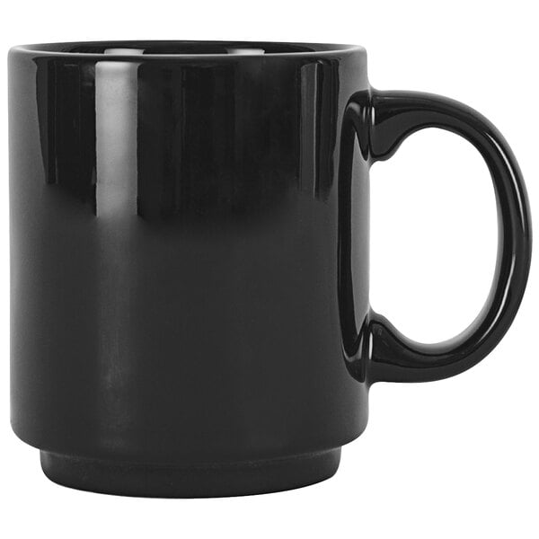 A black Tuxton ceramic coffee mug with a handle.