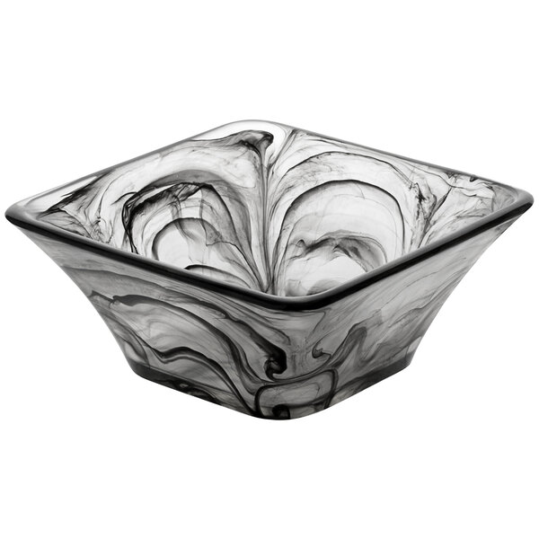 A square black and white glass bowl with swirls.