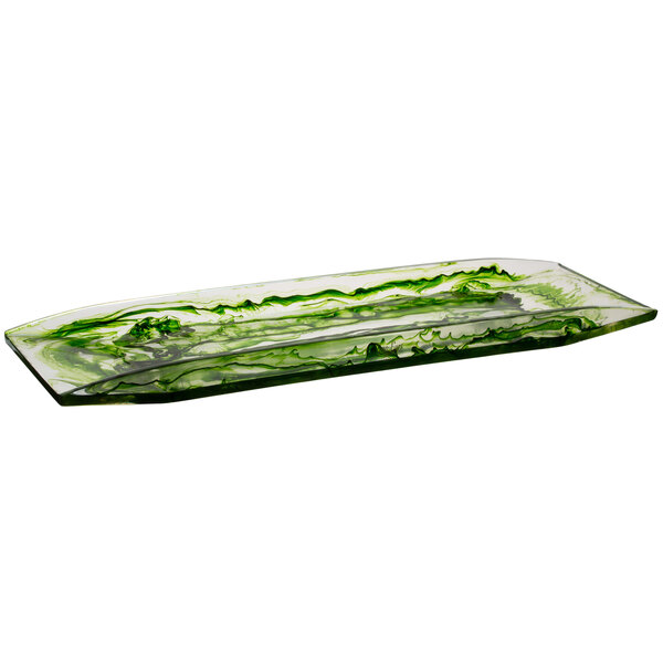 A green rectangular resin platter with a leaf design on a counter.