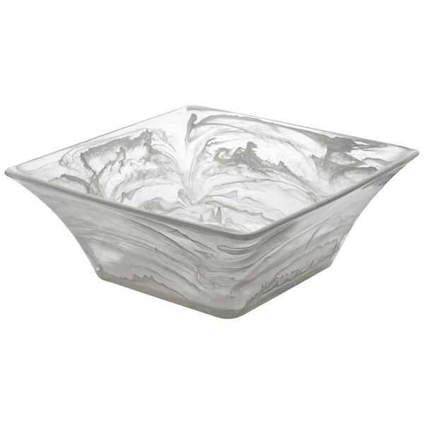 A square white bowl with white swirls.