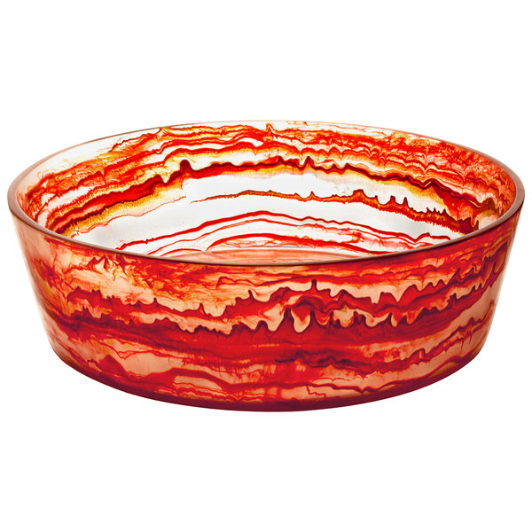 A red and orange Bon Chef resin bowl with swirls on a counter.