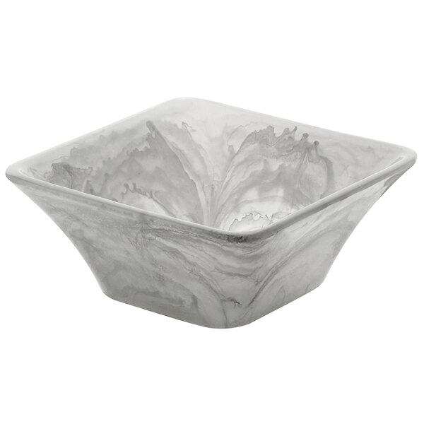 A square white Bon Chef bowl with a swirl pattern.