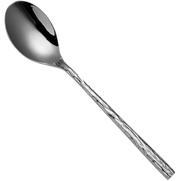 A Sola stainless steel dessert spoon with a textured handle.