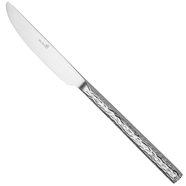 A Sola stainless steel steak knife with a textured silver handle.