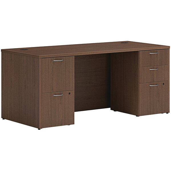 A brown Hon laminate desk with 2 storage pedestals.