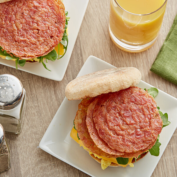 Jones Dairy Farm Fully Cooked Round Style Bacon 0.25 oz. 192/Case