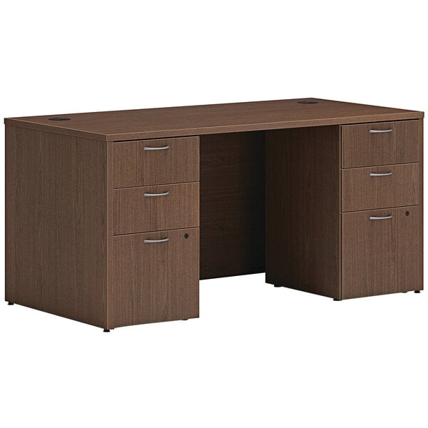 A brown Hon Mod laminate desk with storage pedestals.
