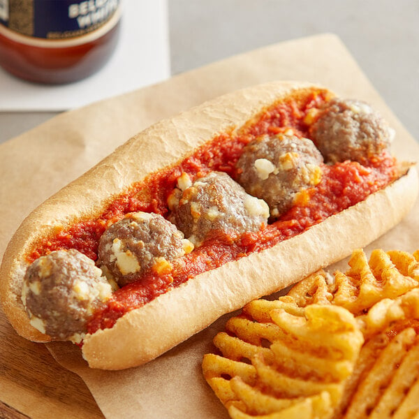 A sandwich with meatballs and High-Temp Cubed Pepper Jack Cheese on it.