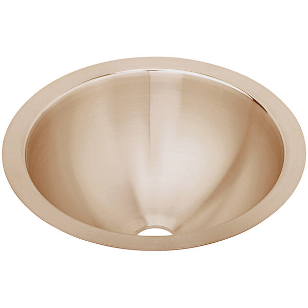 A close-up of the round copper bowl of an Elkay CuVerro antimicrobial undermount sink.
