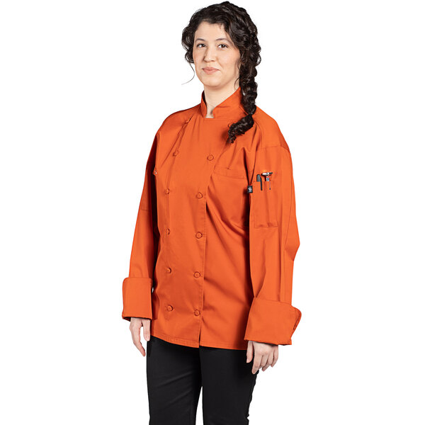 An orange Uncommon Chef Vigor Pro Vent long sleeve chef coat with a mesh back.