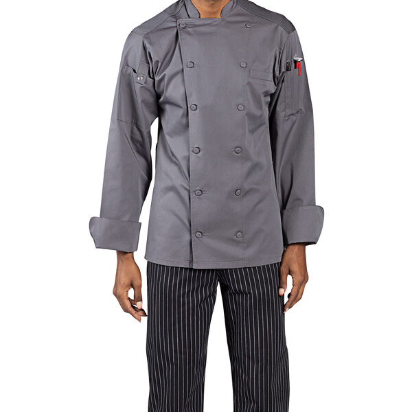 A man wearing a Uncommon Chef Vigor Pro Vent slate gray chef coat with mesh back.