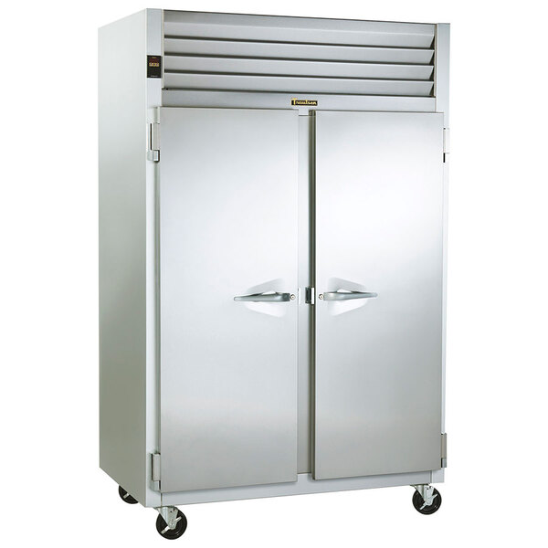 A Traulsen hot food holding cabinet with two doors on wheels.