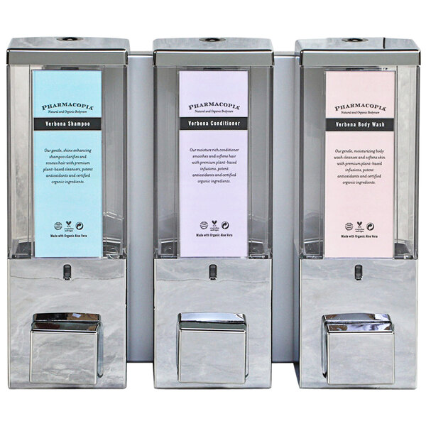 A row of Dispenser Amenities iQon wall-mounted shower dispensers with translucent bottles and Pharmacopia logos.