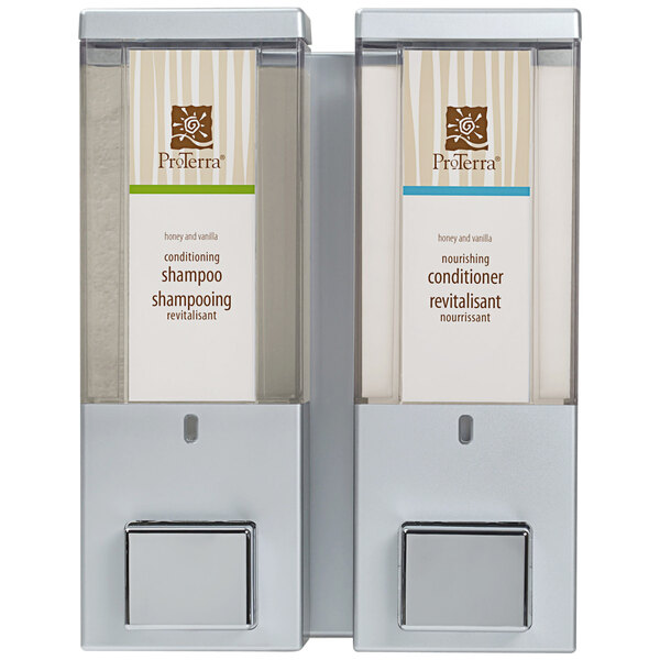 Two wall-mounted satin silver Dispenser Amenities with translucent bottles and ProTerra logo.