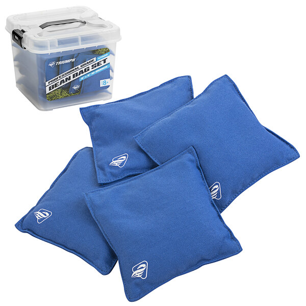 A group of blue Triumph canvas duck cloth bean bags on the floor next to a plastic container with a black handle.