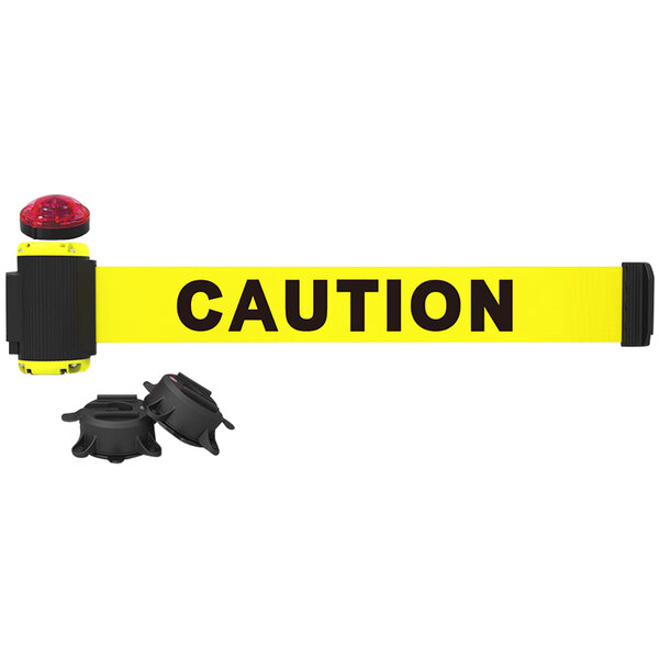 A yellow Banner Stakes barrier tape with black "Caution" text.