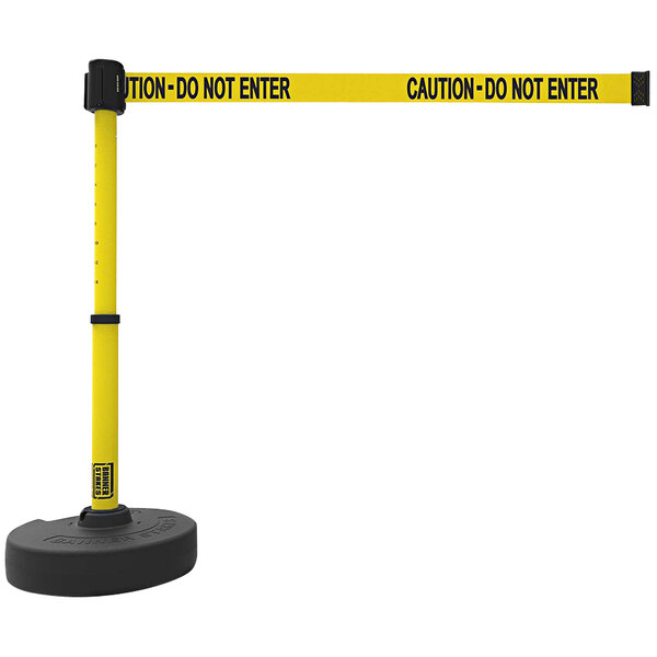A yellow Banner Stakes PLUS retractable barrier with black text reading "Caution - Do Not Enter" and black accents.