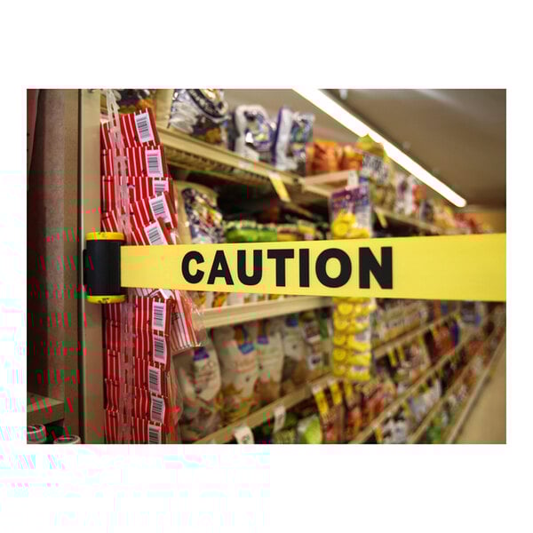 Banner Stakes 7' Yellow "Caution" Wall Mount Belt Barrier MH7001