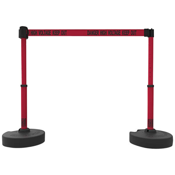 A pair of red and black Banner Stakes barriers with a "Danger High Voltage Keep Out" sign on them.