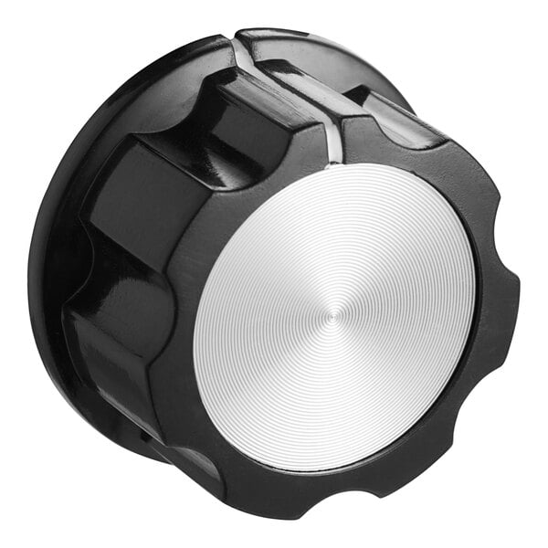 A black and white knob with a silver center.