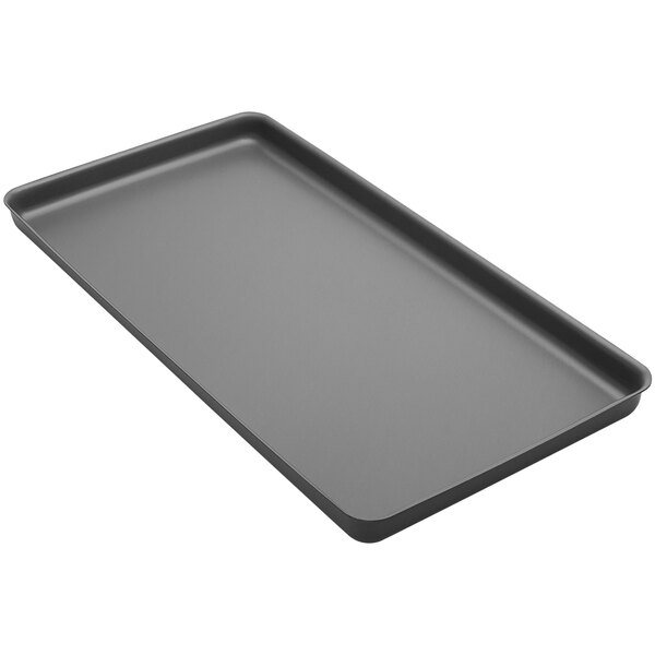 An American Metalcraft rectangular deep dish pizza pan on a black tray.