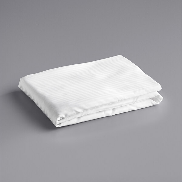 A folded white Oxford Superblend tone on tone stripe fitted sheet.