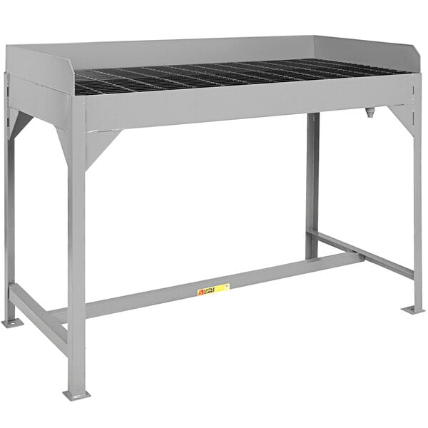 A grey rectangular Little Giant table with metal grating.