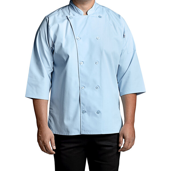 A man wearing a sky blue Uncommon Chef 3/4 length sleeve chef coat.