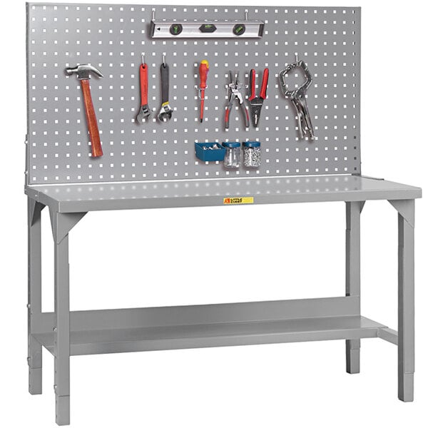 A grey Little Giant workbench with tools on it.