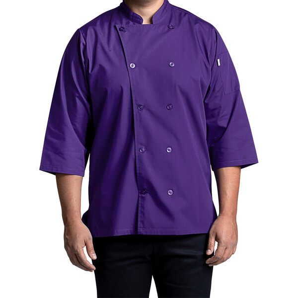 A man wearing an Uncommon Chef grape 3/4 length sleeve chef coat.
