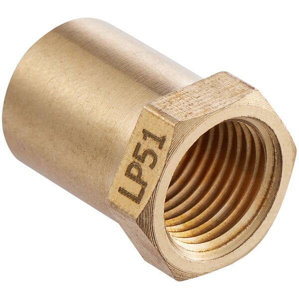 A gold metal burner orifice with a brass threaded nut.