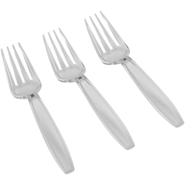 A close-up of three Fineline Flairware clear plastic forks.