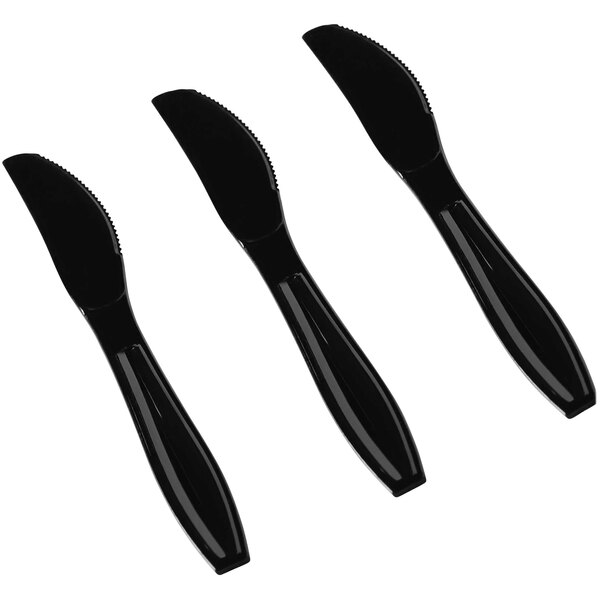 A group of black Fineline Flairware plastic knives.
