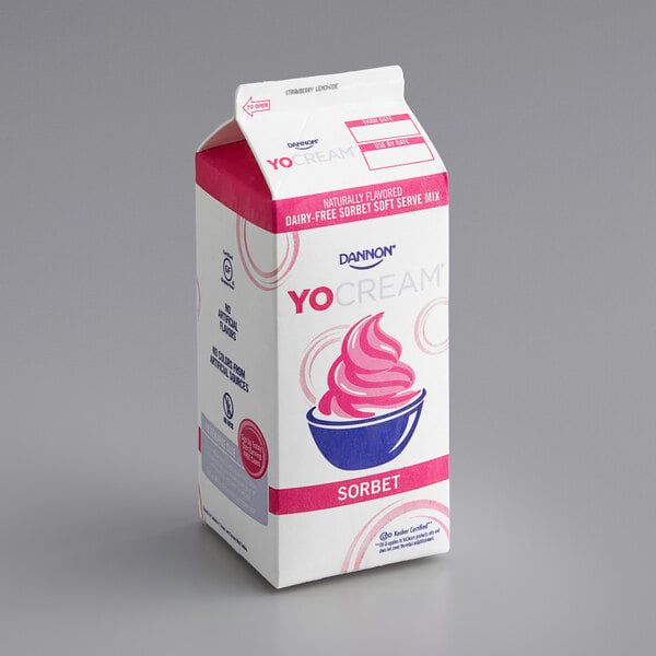 A white and pink carton of Dannon YoCream Low Fat Strawberry Lemonade Sorbet Mix.